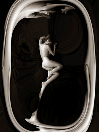 Female Nude Sleeping on Black Background in Oval Frame